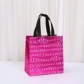 Metallic hot pink non-woven shopping bag with white spiral patterns and black handles - Rose Red