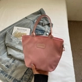 Waterproof pink nylon tote bag with Fashion patch and top handles for casual use - Pink