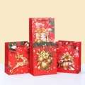 Set of four red Christmas gift bags with reindeer and ornament prints on white cardboard - 23x18x10cm