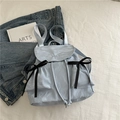 Light blue crinkled fabric backpack with black silk bow accents and Nika embroidery - Blue
