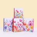 Floral print paper gift bags with white handles in four colorful watercolor styles - Multicolor