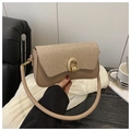Detail of glittery flap and golden arc hardware on beige shoulder bag - Khaki