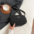 Minimalist black nylon half-moon crossbody bag with silver logo on adjustable strap - Black