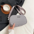 Minimalist light grey nylon crossbody bag with adjustable wide strap for casual wear - Gray