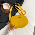 Yellow nylon crossbody camera bag with adjustable strap and dual zipper closure - Yellow