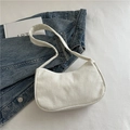 White corduroy hobo shoulder bag with textured finish and wide strap minimalist style - White
