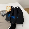 Black canvas tote bag with blue Bear print and cute bread plush charm detail - Black With Pendant