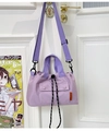 Detail of purple nylon crossbody bag featuring contrast orange label and drawstring closure - Purple
