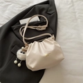 Chic cream leather pleated bucket bag with plush monster charm on grey blazer - White (With Charm)