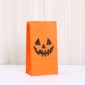 Halloween orange kraft paper gift bag featuring a black Jack-o'-lantern pumpkin face print - Pumpkin Expression 4 (849-4)