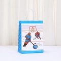 Detail view of sports-themed kraft paper gift bag with blue hockey player illustration - Athletic Dynamic Pattern (554-2)