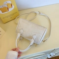 Creamy white cartoon embossed pillow bag with litchi grain leather and golden hardware - Rice White (No Pendant)