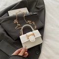 Elegant white mini crossbody bag with gold rectangular buckle and chain strap - White