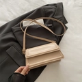 Chic beige flap crossbody bag in minimalist faux leather with adjustable gold buckle strap - Khaki