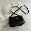 Minimalist black glossy saddle crossbody bag with metal hardware and flap closure - Black