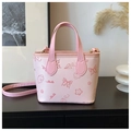 Detail of pink PU crossbody bucket bag with embossed butterfly and floral patterns - Basic Style / Pink