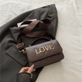 Dark brown quilted cylinder crossbody bag with golden LOVE metal lettering and wide strap - Brown