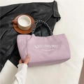 Purple nylon tote bag with white lettering and sturdy black and white woven handles - Purple