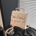 Mini sac à dos beige chic pour femmes avec des nœuds mignons et bretelles réglables - Blanc