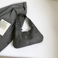 Dark grey pleated tote bag with suede texture and wide strap in a minimalist style - Black