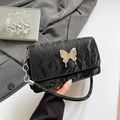 Fashionable black pleated shoulder bag featuring a silver mirror butterfly metal buckle - Black