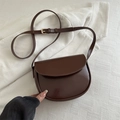Dark brown matte leather saddle bag with adjustable shoulder strap and gold buckle - Brown
