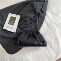 Elegant black woven cloud clutch bag with slim shoulder strap and minimalist leather texture - Black