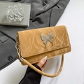 Fashionable mustard yellow wrinkled leather underarm bag with silver butterfly and chain - Brown