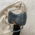 Blue denim underarm bag with rhinestones and silver chain strap on white fabric - Dark Blue