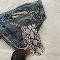 Women's crossbody bag with black and white snake print and fringe details on denim - White