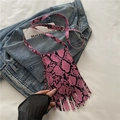 Pink snakeskin pattern crossbody bag with fringe tassels and adjustable shoulder strap - Pink