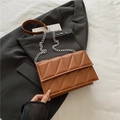 Brown quilted crossbody bag with triangle stitching and silver chain strap details - Brown