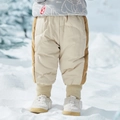 Winter kids down pants with beige corduroy patchwork and elastic cuffs in the snow - Birch White / 80cm