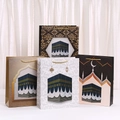 Set of four Middle Eastern architectural kraft paper gift bags with golden braided handles - Small