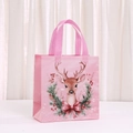 Detailed view of pink non-woven Christmas gift bag with cartoon reindeer and wreath - Cartoon Reindeer Christmas Wreath Style (5034-1)