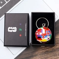 Close-up of a soccer ball keychain with world flags in a FIFA branded gift box - Style D Soccer Ball Keychain With Gift Box