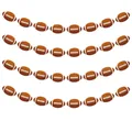 Detail of American football themed banners with brown oval cutouts and white stitching - American Football