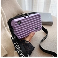 Miniature purple hardshell crossbody vanity bag with horizontal grooves and strap - Light Purple