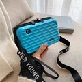 Mini hardshell crossbody bag in bright blue with luggage-style stripes and logo strap - Sky Blue