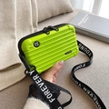 Lime green hard shell crossbody bag with Forever Young strap and ribbed luggage style - Fruit Green