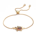 Adjustable golden box chain bracelet featuring a turtle charm with colorful zircon stones - Gold