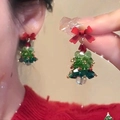 Christmas tree earrings with red bow and festive beads shown on ear and hand - Bowknot Beaded Christmas Tree Style (7278)