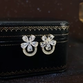 Elegant gold flower earrings with sparkling crystals displayed on a vintage jewelry box - E5486 Silver Needle - Gold