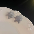 Elegant silver maple leaf earrings with sparkling cubic zirconia on a white plate - E5358 Silver Needle - Silver