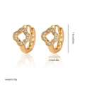 Detailed view of gold-plated clover earrings with zircon inlay showing 1.5cm height dimensions - EH252