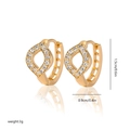 Detailed view of gold-plated hoop earrings with leaf design and white zircon stones - EH253
