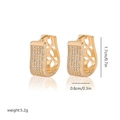 Detail of gold-plated U-shape earrings with zircon micro-pave and hollow pattern - EH242