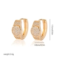 Detailed view of gold plated huggie earrings with white zircon measuring 1.5cm high - Eh247