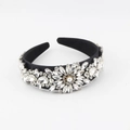 Close-up of baroque wide headband featuring sparkling crystal flowers and a pearl center - Black Fabric Clear White Rhinestone (F)