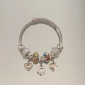 Detail of silver beaded bracelet featuring heart pendants and colorful glass charms - Colorful Double Heart Flower Bracelet
